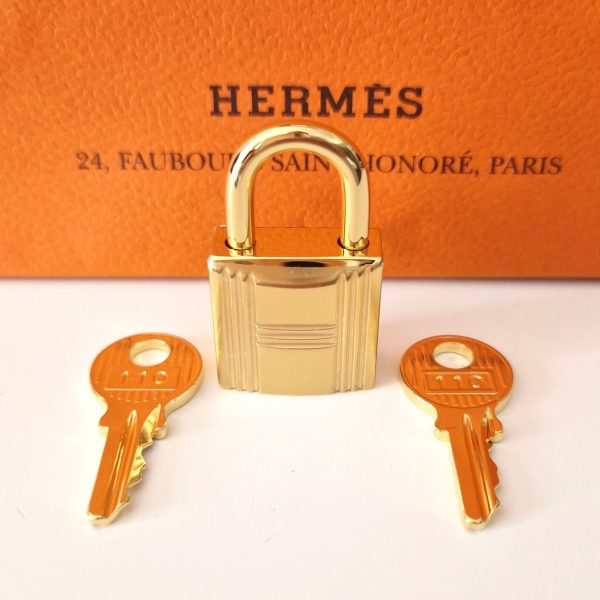 Cadenas Hermès doré pour sac Birkin Kelly ou Bolide