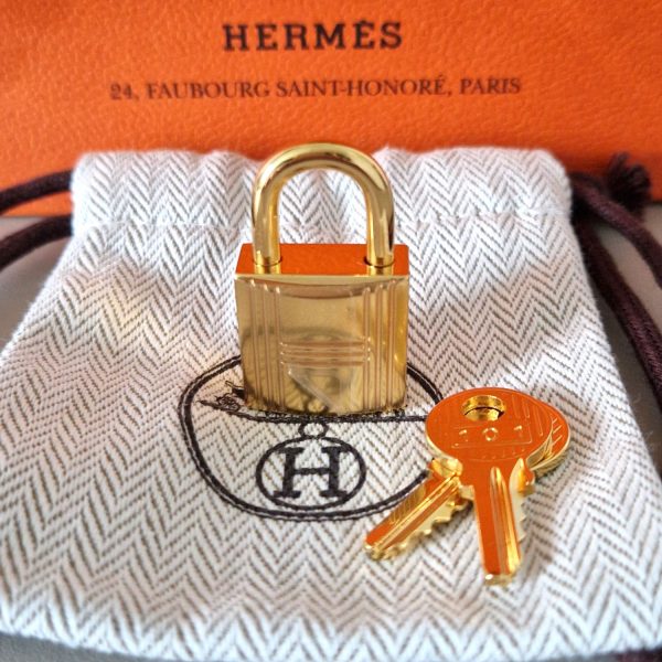 Cadenas Hermès doré pour sac Birkin Kelly ou Bolide