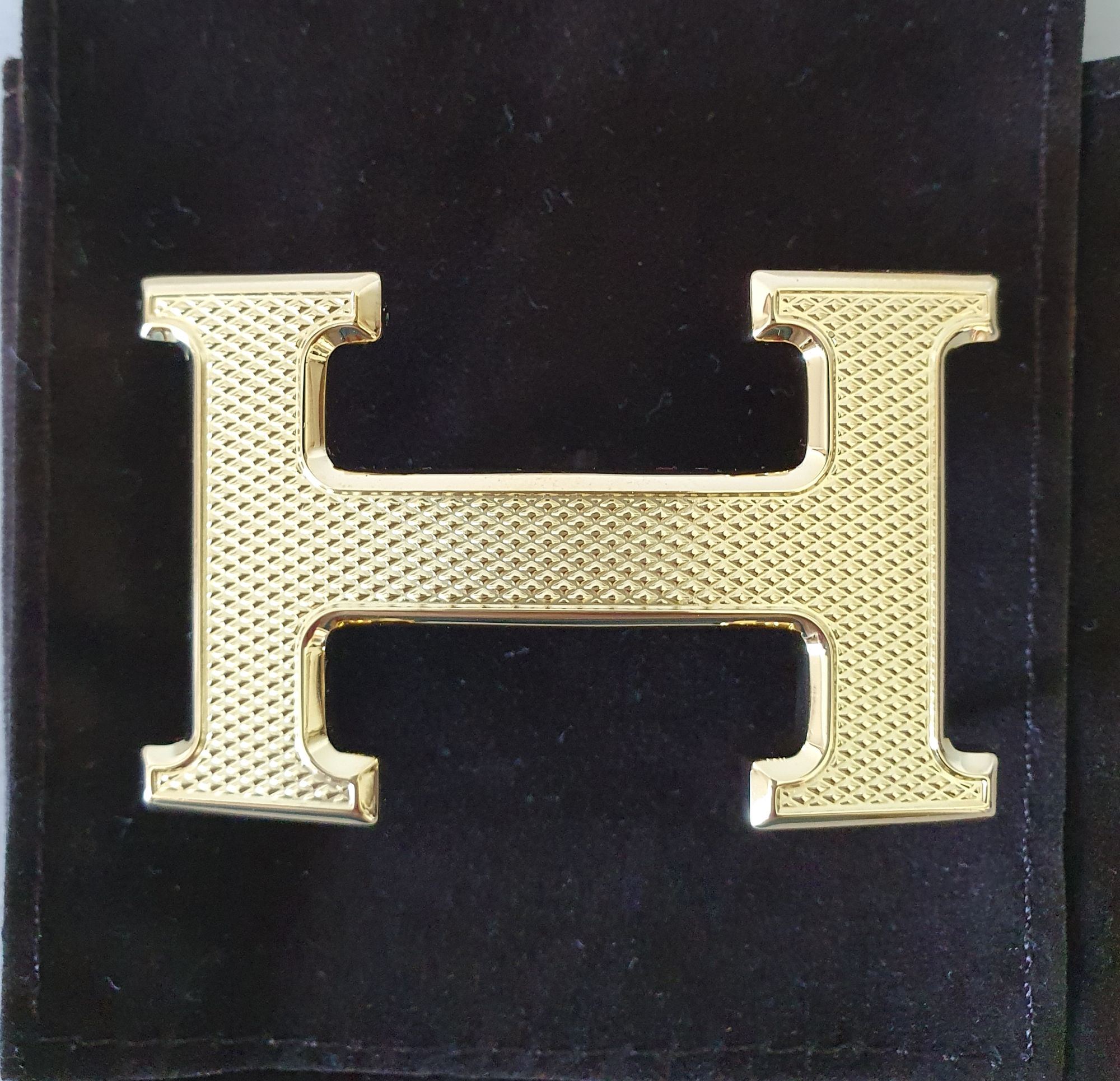 Hermès H guillochée belt buckle in gold plated metal