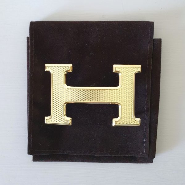 Boucle de ceinture Hermès H en métal doré guilloché